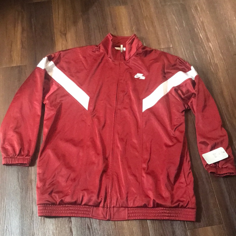 Nike Jumpsuit with Zip up and Pants.